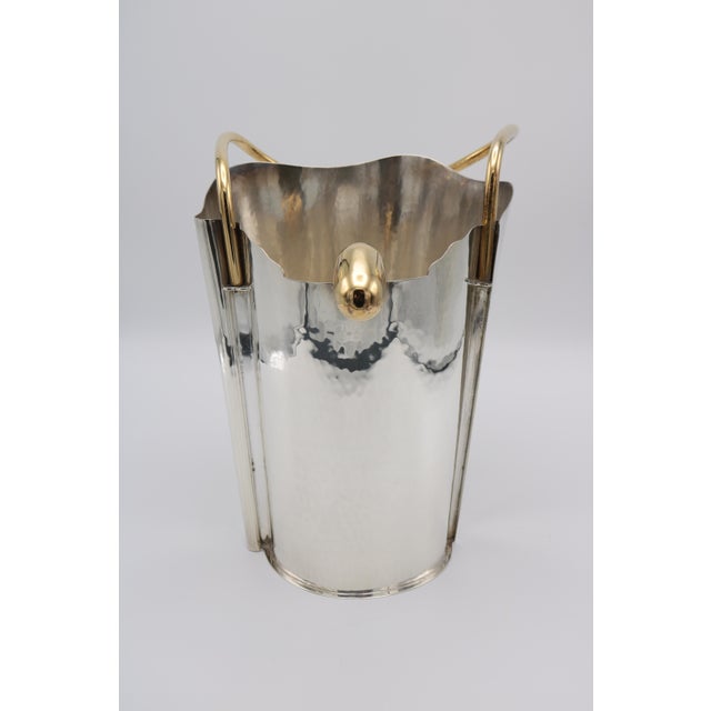 A sterling silver champagne cooler designed by Borek Sipek for Cleto Munari. Hand hammered sterling silver with gold-...