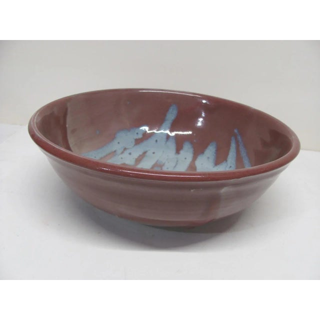 Very nice decorative bowl by Ishmael Soto. Abstract glaze design in dusty rose and blue glazes. It is made from stoneware....