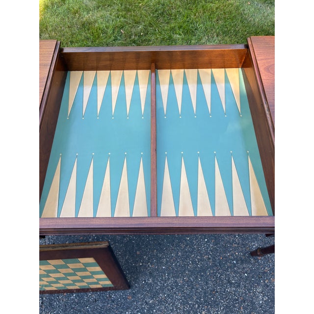 This is a very rare gaming table. The table made of french walnut with solid brass pulls. I love the colors of the leather...