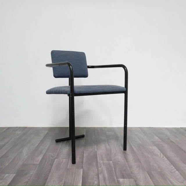 Minimalist Armchair with a Postmodern Twist, 1980s Modernist Design. Frame entirely in black painted metal, seat and...