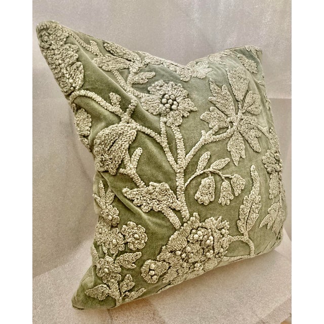 The product is a decorative pillow cover featuring a floral chenille embroidered design on sage washed velvet material....