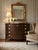 This vintage elegant piece features a rich, deep mahogany (or mahogany-veneer) finish with a warm, lustrous glow that...