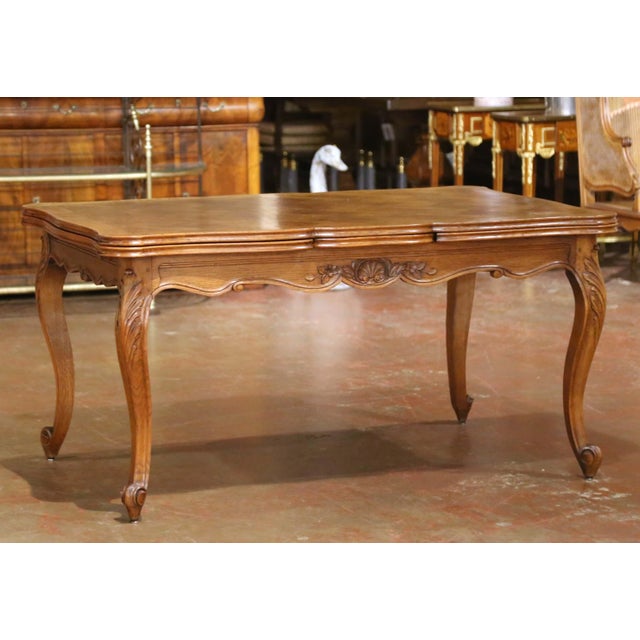 Bring classic French elegance to a dining room or breakfast room with this handsome antique-style extension dining table....