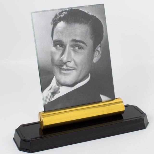 Made in France circa 1940, this stunning modernist Art Deco picture frame is built with brass and Bakelite. The piece...
