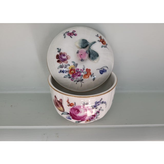 This exquisite antique lidded porcelain box beautifully highlights the Neo-Rococo revival taste popularized in Germany at...