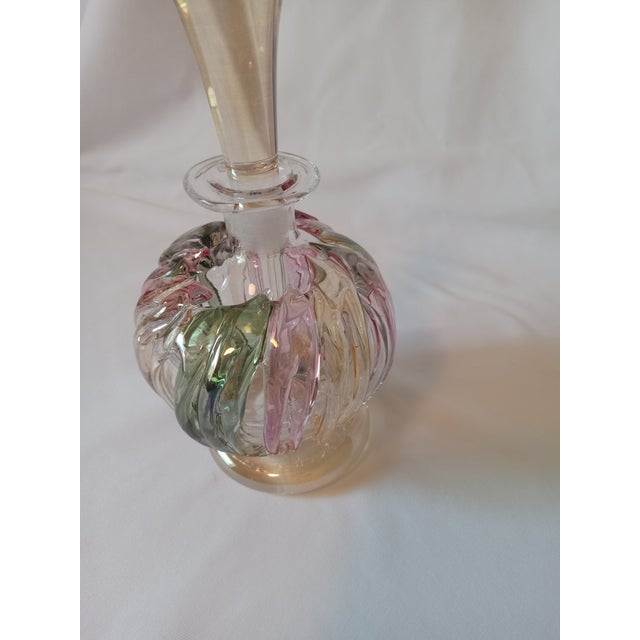 Handcrafted and mouth blown perfume bottle made by world renowned Romanian art glass master Ion Tamaian. The bottle is...