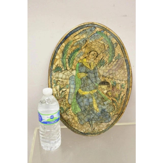 Antique Persian Iznik Qajar Style Ceramic Pottery Oval Tile Kneeling Woman C3. Item features original crackle glazed...