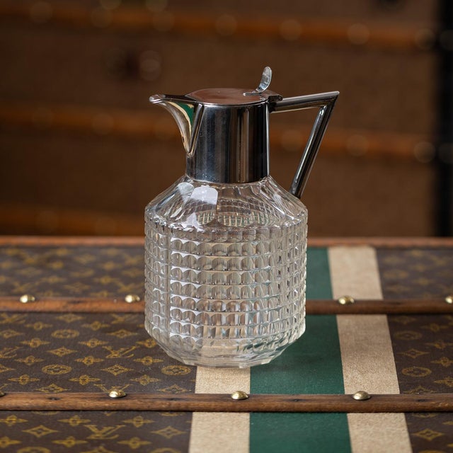 Antique 19th century german silver plated and cut glass claret jug. The glass sides of the jug are cut in a geometric...