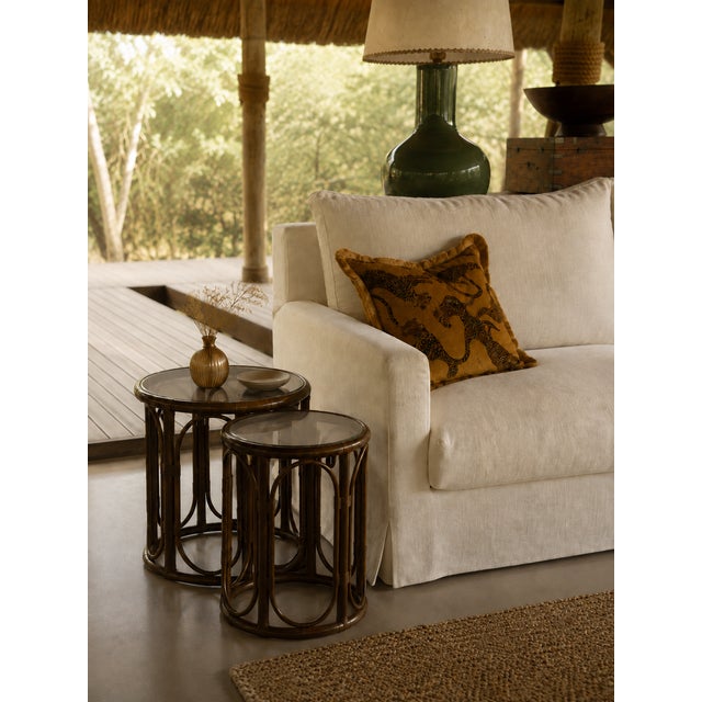 Vintage three-piece set from the 1970s, comprising two round side tables and a wall mirror, crafted from natural bamboo...