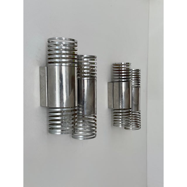 Pair of double wall sconces with a chromed metal frame, produced in France in the 1970s. A beautiful piece of French...
