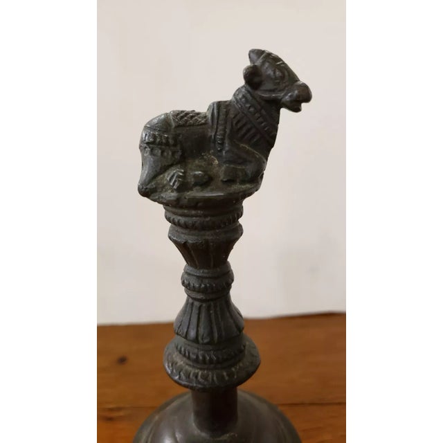 This is a Mid 20th Century Indian Hindu Bronze Ghanta Nandi the Bull Handle Ritual Hand Bell. It measures 8 1/4" tall and...