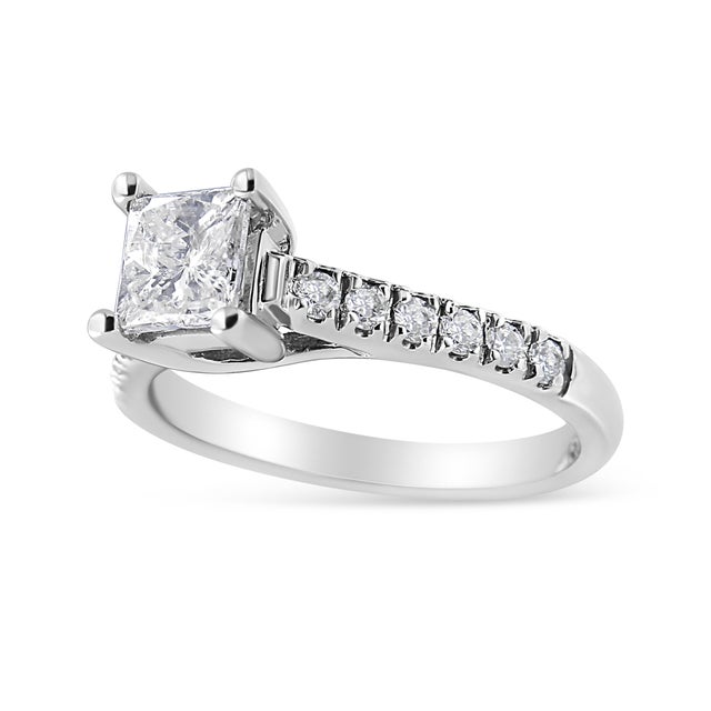 Express all the love you hold in your heart for that special someone with this shimmering diamond engagement ring. Eye-...