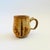 A vintage studio pottery mug with a lovely terra cotta glaze. Measures 5"W x 3.25"D x 4"H