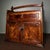 Exquisite portable rosewood cabinet fitted with a sturdy overhead carry handle. The front displays spectacular burl wood...