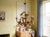 A Hollywood Regency style six-light gilt metal chandelier with tôle lily flowers. Original canopy and chain. Designed by...