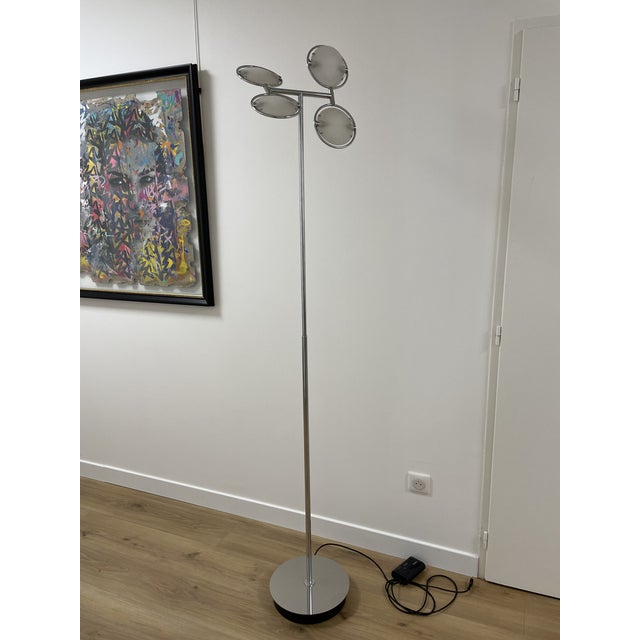 Nobi 4 model floor lamp by fontana arte and dating from the 1990s. Chromed metal structure which supports two pairs of...