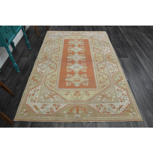 Vintage Turkish Hand-Knotted vintage rug is a semi-antique vintage area rug. The '70s Eastern region of Turkey's unique...