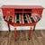 This striking demilune desk (or console) was hand-painted by artist collective Stonehouse Farm Goods for designer Tracy...