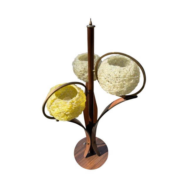 Embrace the charm of the mid-century modern era with this striking 3-light table lamp. The Spaghetti Lucite Ribbon Shade...