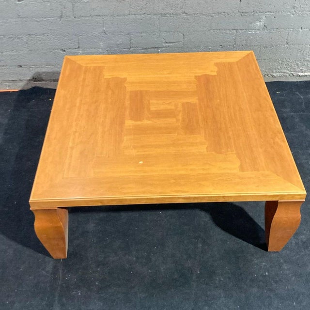 This Giorgetti coffee table features a square wooden top and elegant, sturdy legs. Its clean lines and warm wood finish...
