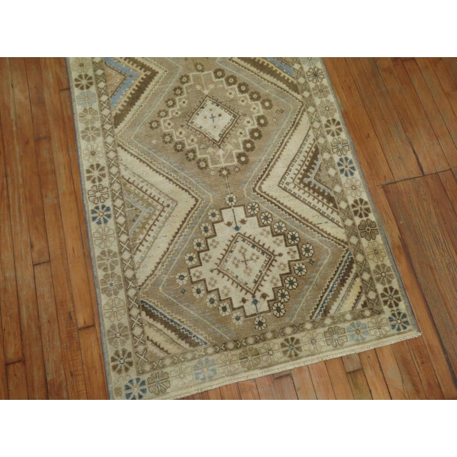 Tribal Persian runner in soft blues, clear white, browns and khaki color tones. 3'5'' x 10'2''