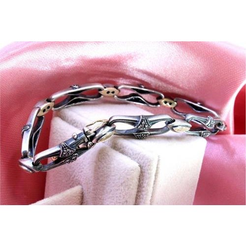 Gold and Silver Bracelet with Central Crowned Diamonds, in Very Good conditions. Designed 1980 to 1989 This piece has an...