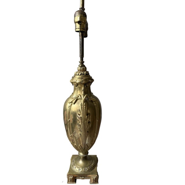 The continental bronze urn form table lamp by Nerdmann Aeramenn features a striking design that combines elegance with a...