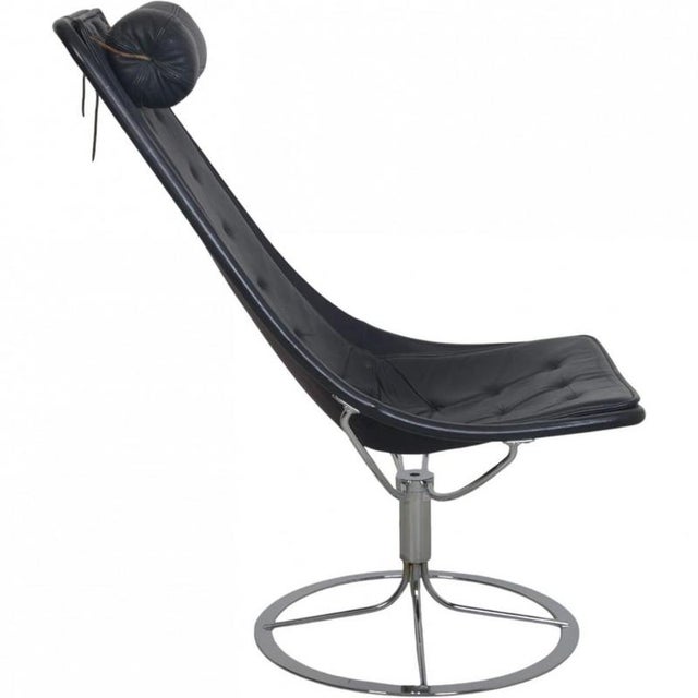 Jetson chair designed by Bruno Mathsson from 2006. The chair is upholstered in black leather and has a chrome frame. The...