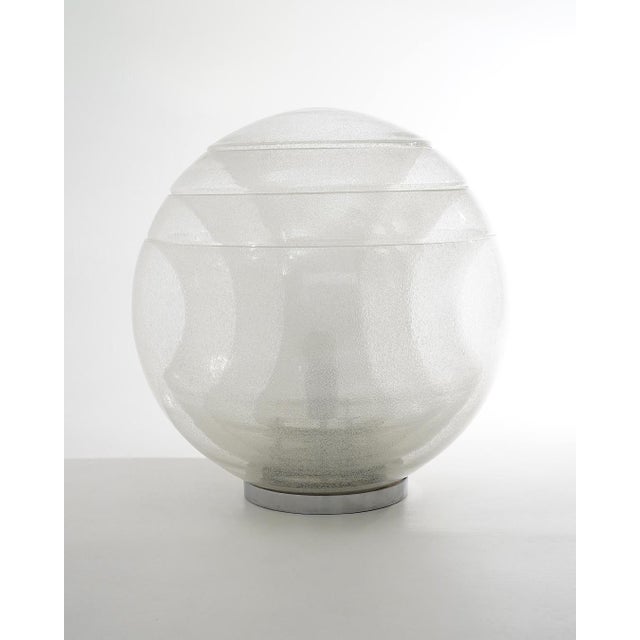 Designed by Carlo Nason for Mazzega in the 1970s, the LT328 table lamp exemplifies the experimental approach to volume and...