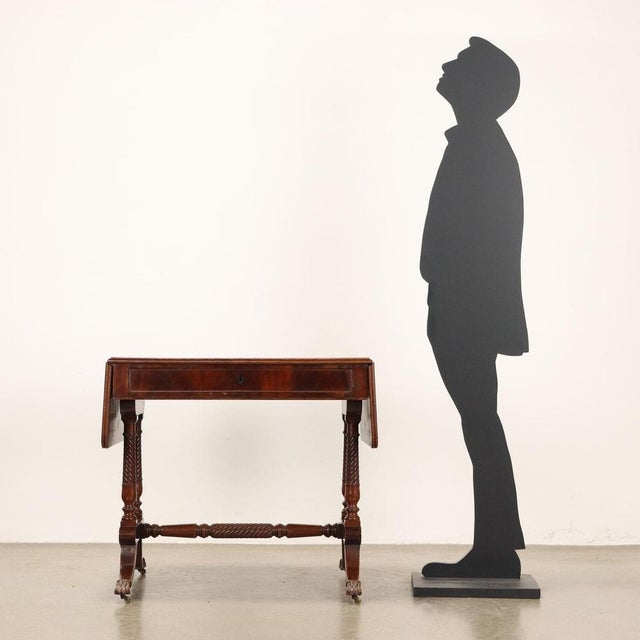 Regency mahogany writing desk, top with side bands and central drawer under the top supported by four legs joined by a...