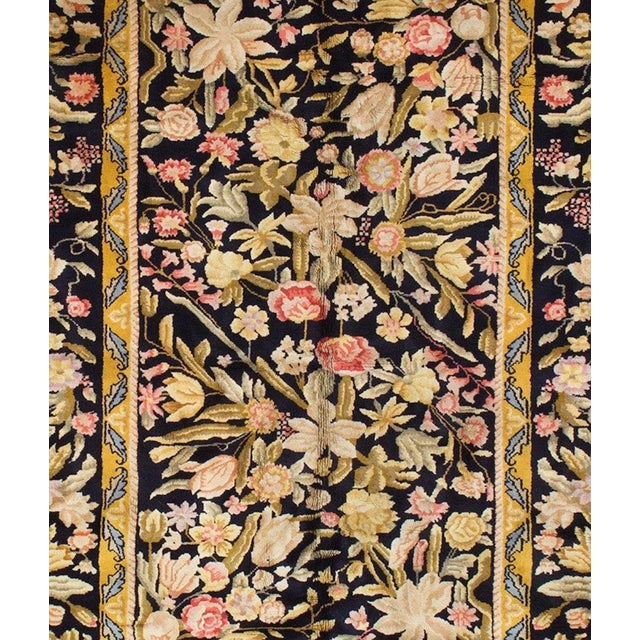 This a rare, large, and pristine antique Austrian Savonnerie in midnight blue dating back to the 1940s. It measures: 8.2 x...