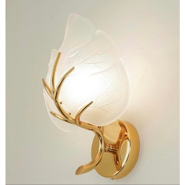 15” tall 10” wide 5” deep Elevate your home decor with this exquisite, nature-inspired wall sconce. Blending the organic...