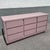 This postmodern dresser makes a striking statement through its bold cubic form and soft mauve gloss finish. Clean...