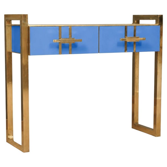 This Italian-designed console table in cornflower blue Murano glass and brass is designed to bring light and color to...