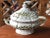 Gorgeous Italian lidded tureen with ladle hand-painted in a lovely olive green over a rich off-white glaze. Both lid and...