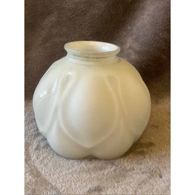 3.5" wide 4.5" tall This lovely shade features a classic bulbous shape with a distinctive embossed petal design that...