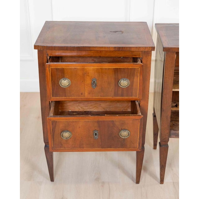 A refined pair of Tuscan bedside tables from the second half of the 18th century, beautifully veneered in walnut and...