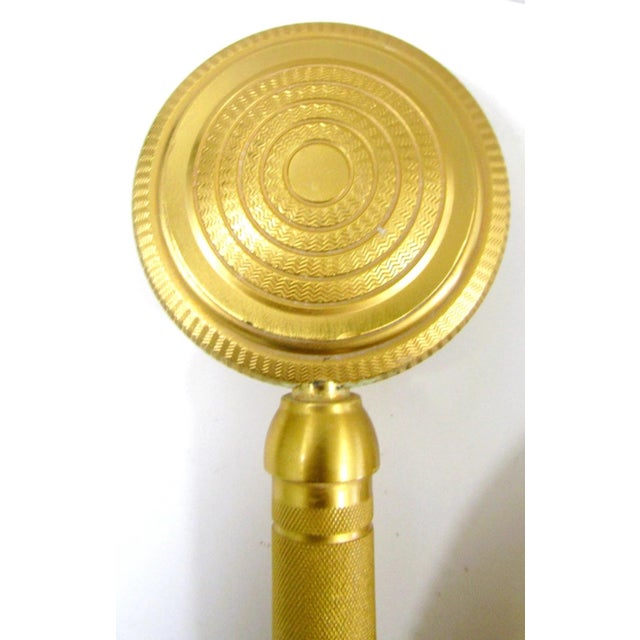 The Sherle Wagner Gold Plated Knurled Hand Shower with Hose 0832SPLY-GP is a luxurious shower head made of brass and...