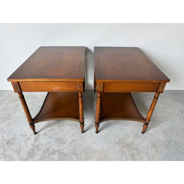 This Pair of Vintage John Scalia for Schmieg & Kotzian Galleried Style One-Drawer Nightstands features a warm mahogany...