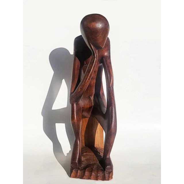 Crafted from a solid piece of wood this Thinking Man carving resembles the angles of Matisse's dance figures, and his pose...