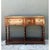 This vintage double-sided campaign console table is a masterful example of classic campaign-style furniture, distinguished...
