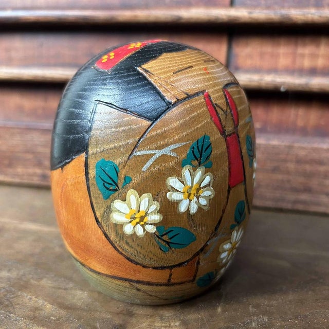 Decorative vintage Kokeshi made by the renowned artisan Hajime Miyashita. This Kokeshi features a cute design with a...