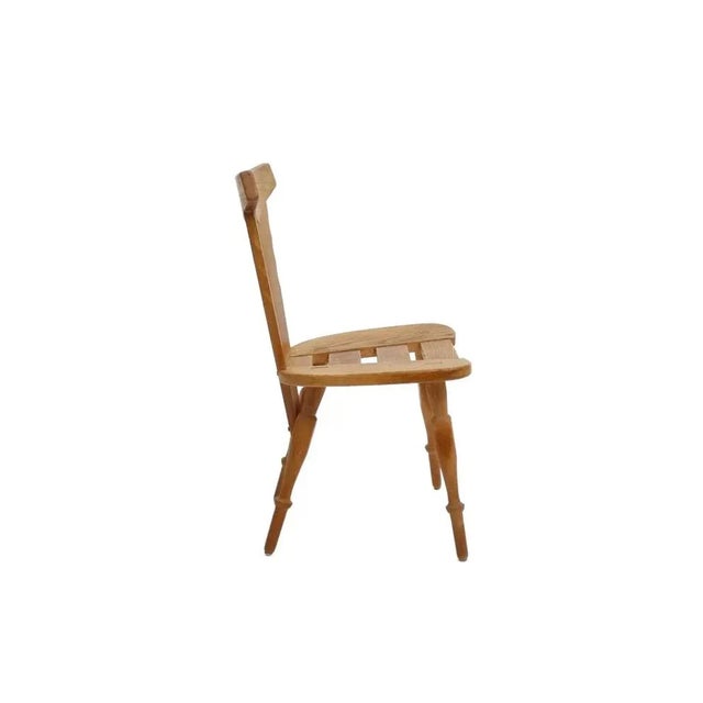 Set of three dining chairs made in Belgium in the 1960s, reflecting Brutalist design influences. The chairs are...