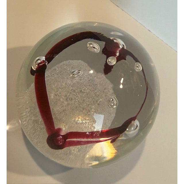 For sale is a 2.75" art glass crystal globe paperweight that came from a collection of Karlov Svoboda pieces. It is signed...