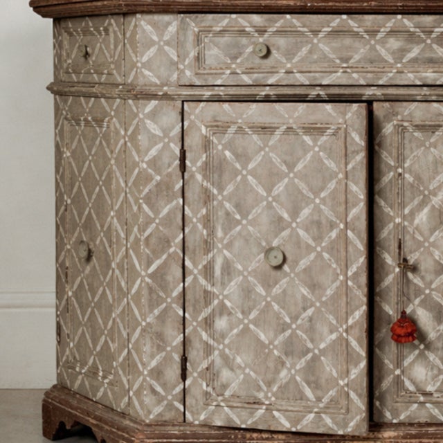 This polychrome Florentine cupboard features an intricate geometric pattern of diamonds created with a delicate palette of...