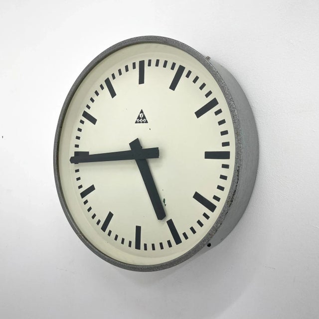 Large vintage Industrial metal wall clock made in former Czechoslovakia by Pragotron in the 1950s. Pragotron produced...