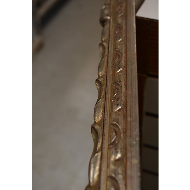 This wall mirror feels quite substantial. Appears to be a mix of plaster (looking at the couple of small chipped areas) &...