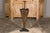 An English brass umbrella stand from circa 1920-1930 shaped as an umbrella with raised motifs and tripartite base. Step...