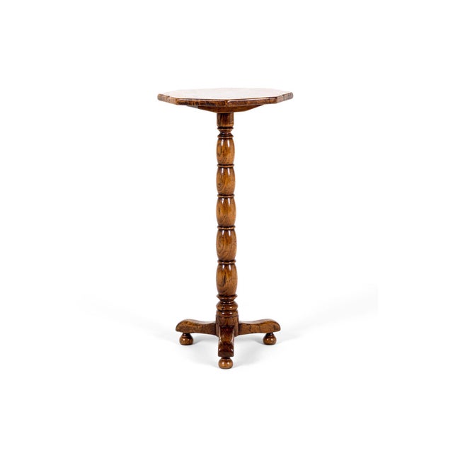 An unusual 19th century wine table or occasional table with a beautiful octagonal walnut top. The top with a bevelled edge...