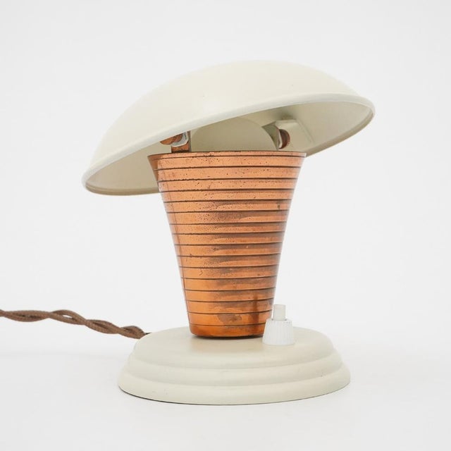 Adjustable bedside lamp from the 1930s characterized by a clean and functional design language, typical of domestic...